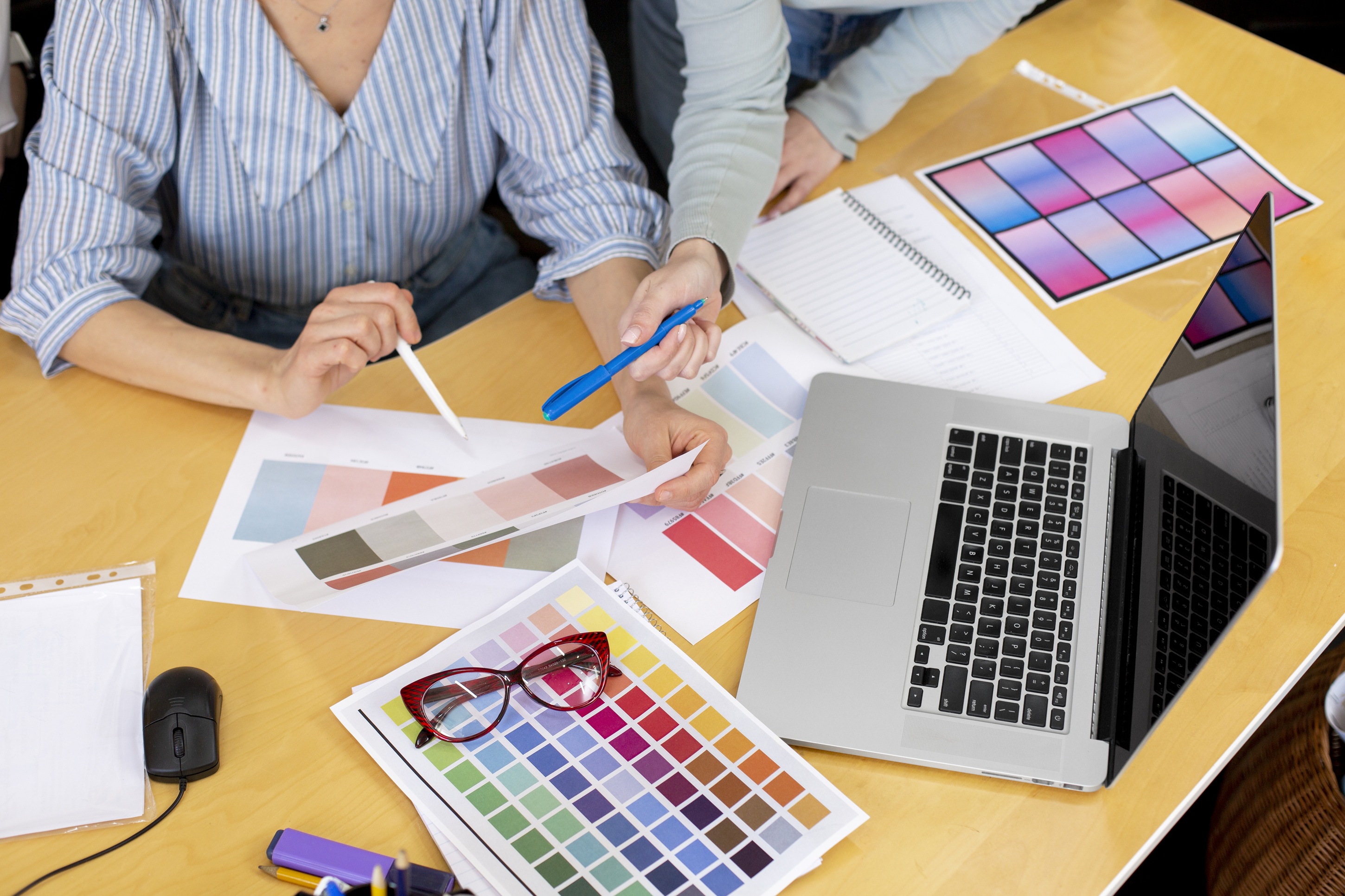 high-angle-woman-working-with-color-palettes.jpg