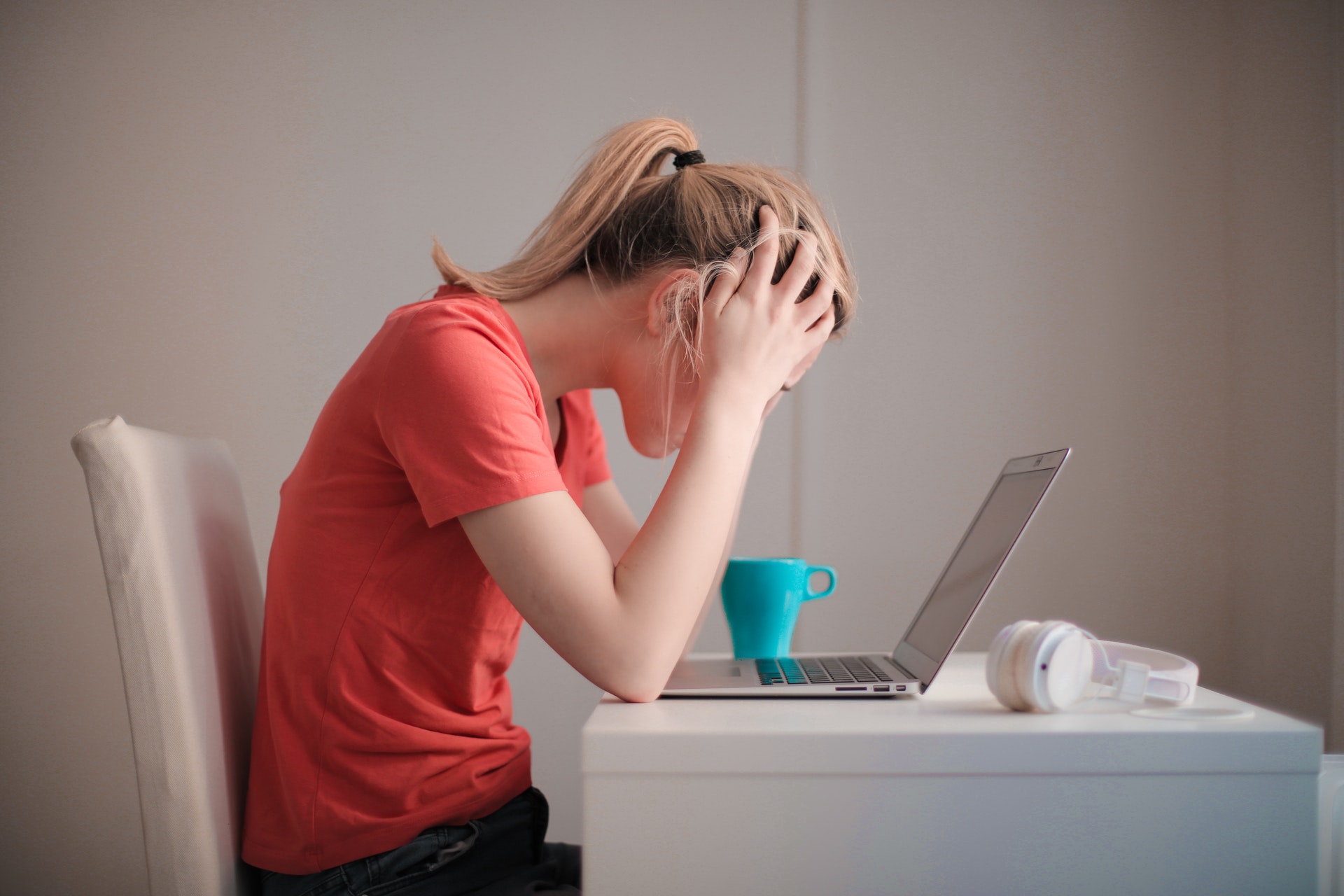 woman-in-red-t-shirt-looking-at-her-laptop-3755761.jpg