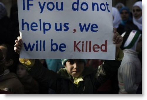 syria-massacre-child-with-sign-for-help.jpg