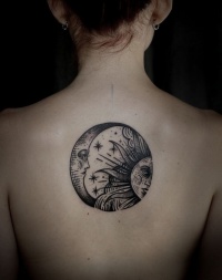 cool_black-ink_sun_and_moon_in_circle_tattoo_on_upper_back.jpg