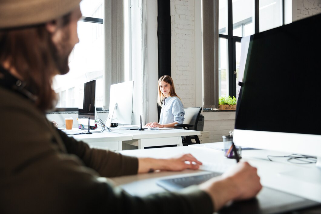 young-colleagues-work-office-using-computers_171337-6830.jpg