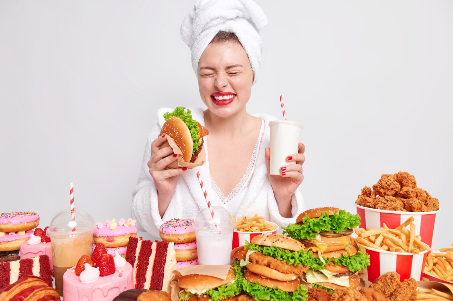 diet-failure-unhealthy-lifestyle-concept-overjoyed-young-woman-holds-hamburger-fizzy-drink_wayhomestudio_freepik.jpg