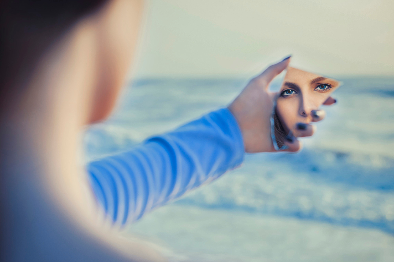female-fair-haired-model-mirror-looking-herself_azerbaijan_stockers_freepik.jpg