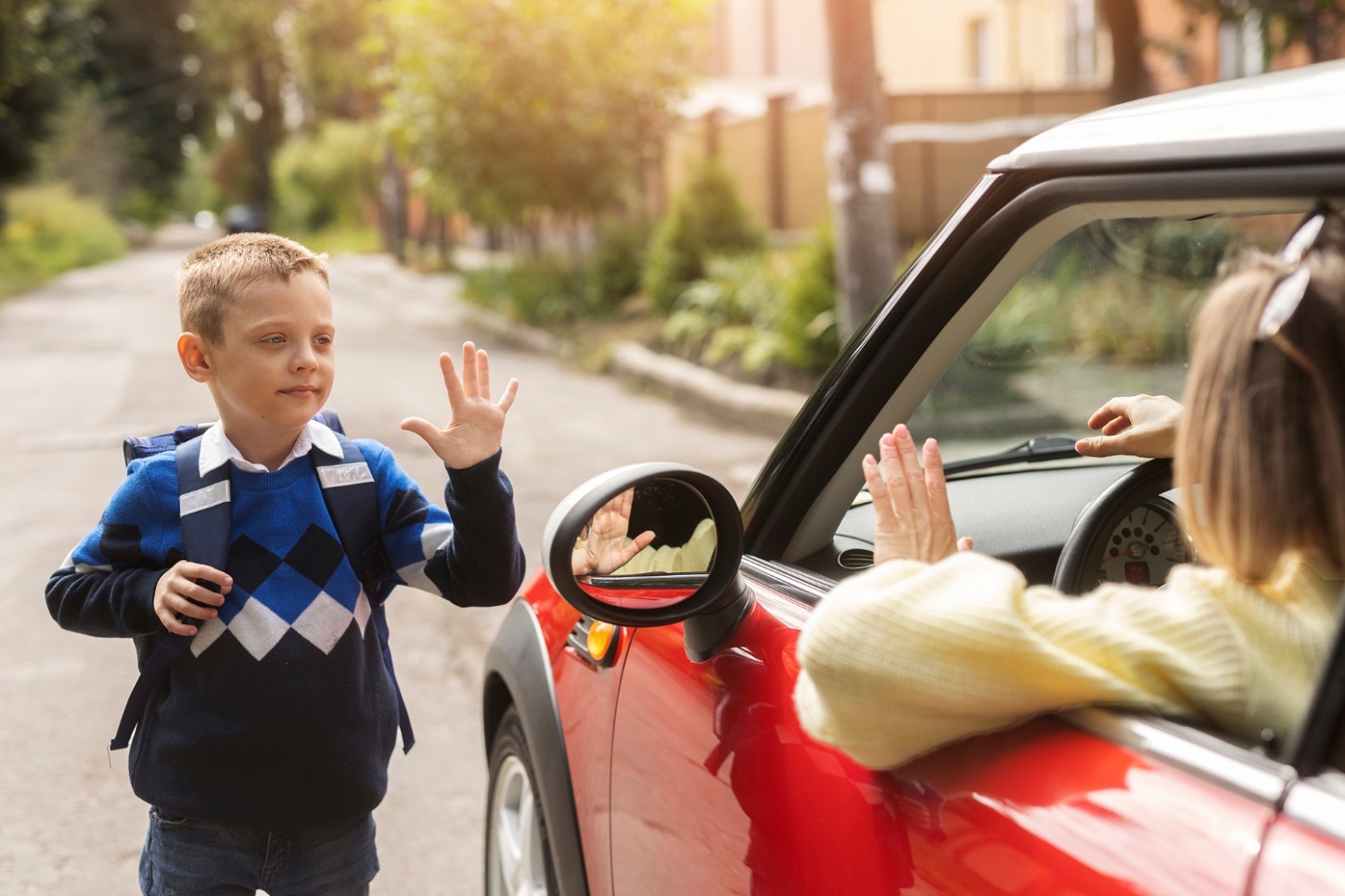 front-view-kid-waving-mother_freepik.jpg