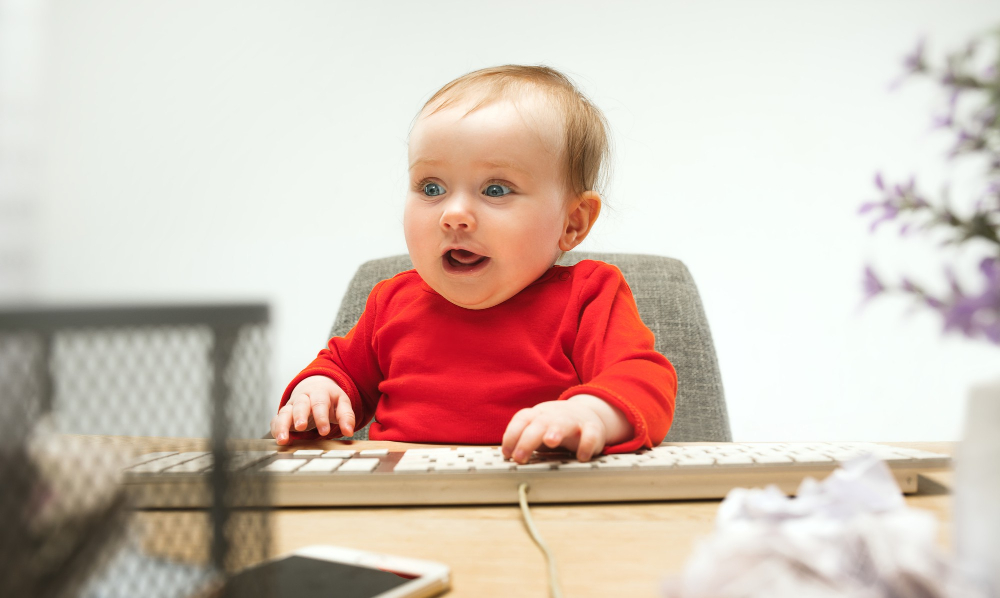 happy-child-baby-girl-toddler-sitting-with-keyboard-computer-isolated-white_master1305.jpg