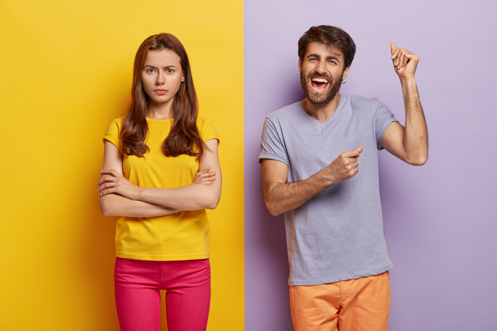 happy-millennial-couple-posing-against-dual-colored-wall_wayhomestudio_freepik.jpg
