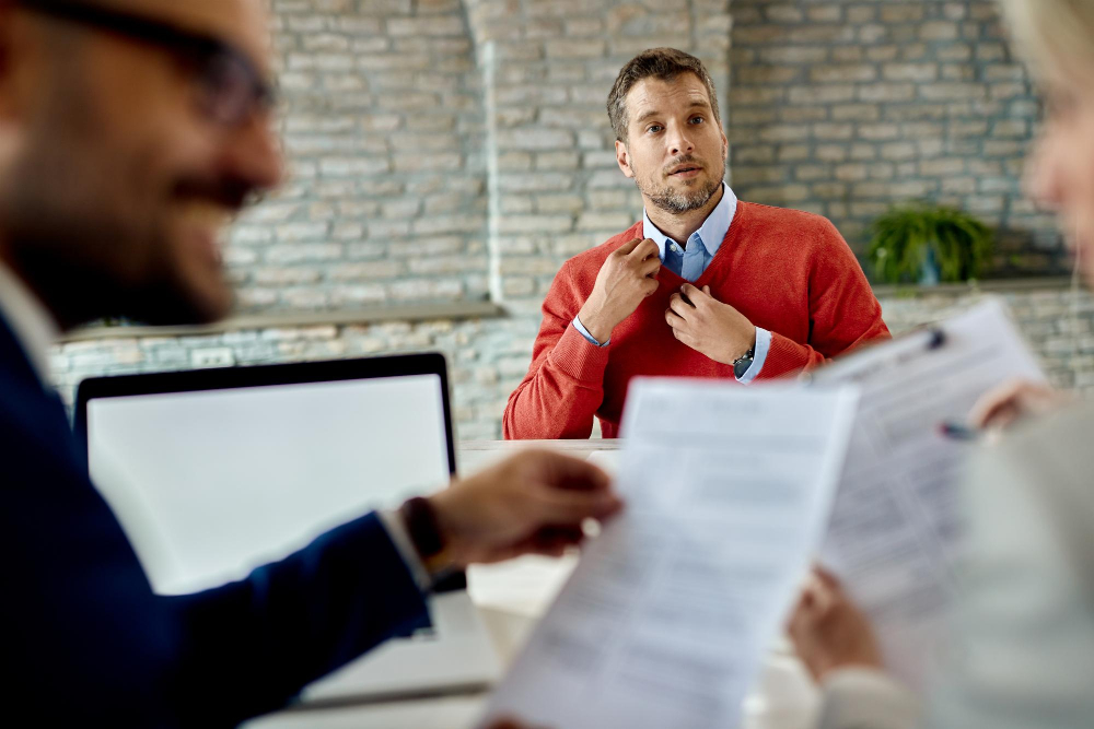 mid-adult-man-applying-job-waiting-human-resource-team-review-his-resume-office_drazen_zigic_freepik.jpg