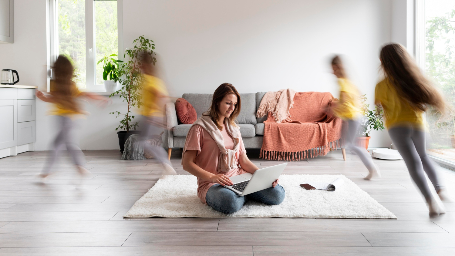 woman-trying-work-laptop-from-home-while-her-children-are-running-around_freepik.jpg