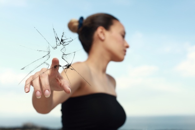 woman-looking-side-while-breaking-glass-with-finger_1122-961.jpg