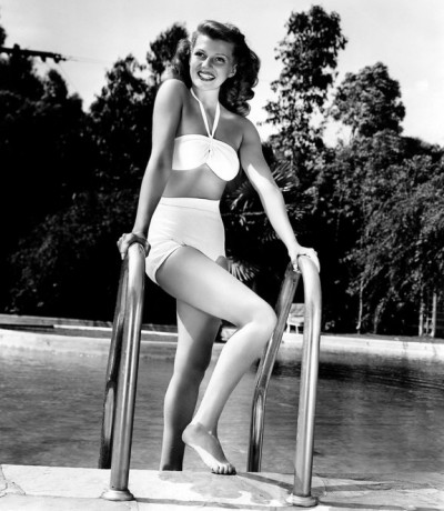 rita-hayworth-at-home-poolside-in-a-white-bikini-1946-fun-in-the-sun-4-400x460.jpg