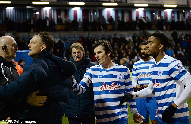 24914e8c00000578-0-qpr_captain_joey_barton_restrains_clint_hill_at_full_time_who_wa-m-3_1420913342732.jpg