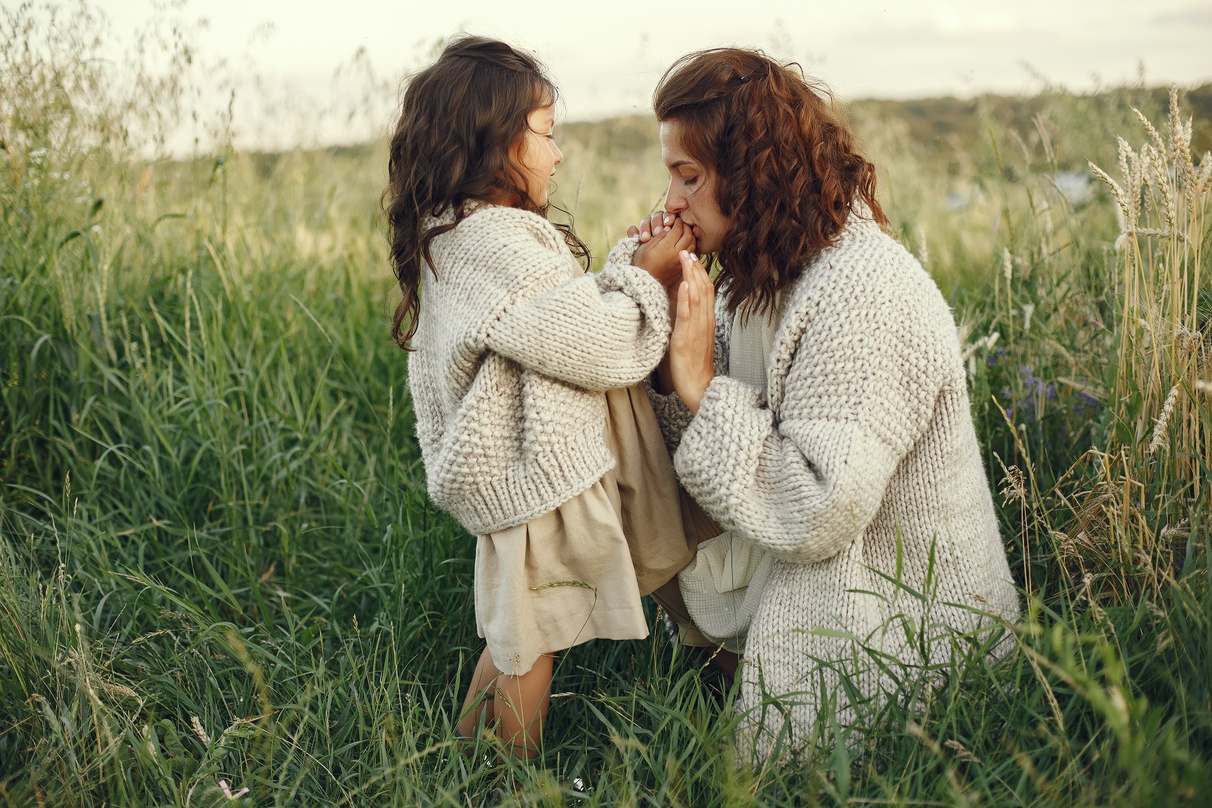 mother-with-daughter-playing-summer-field.jpg