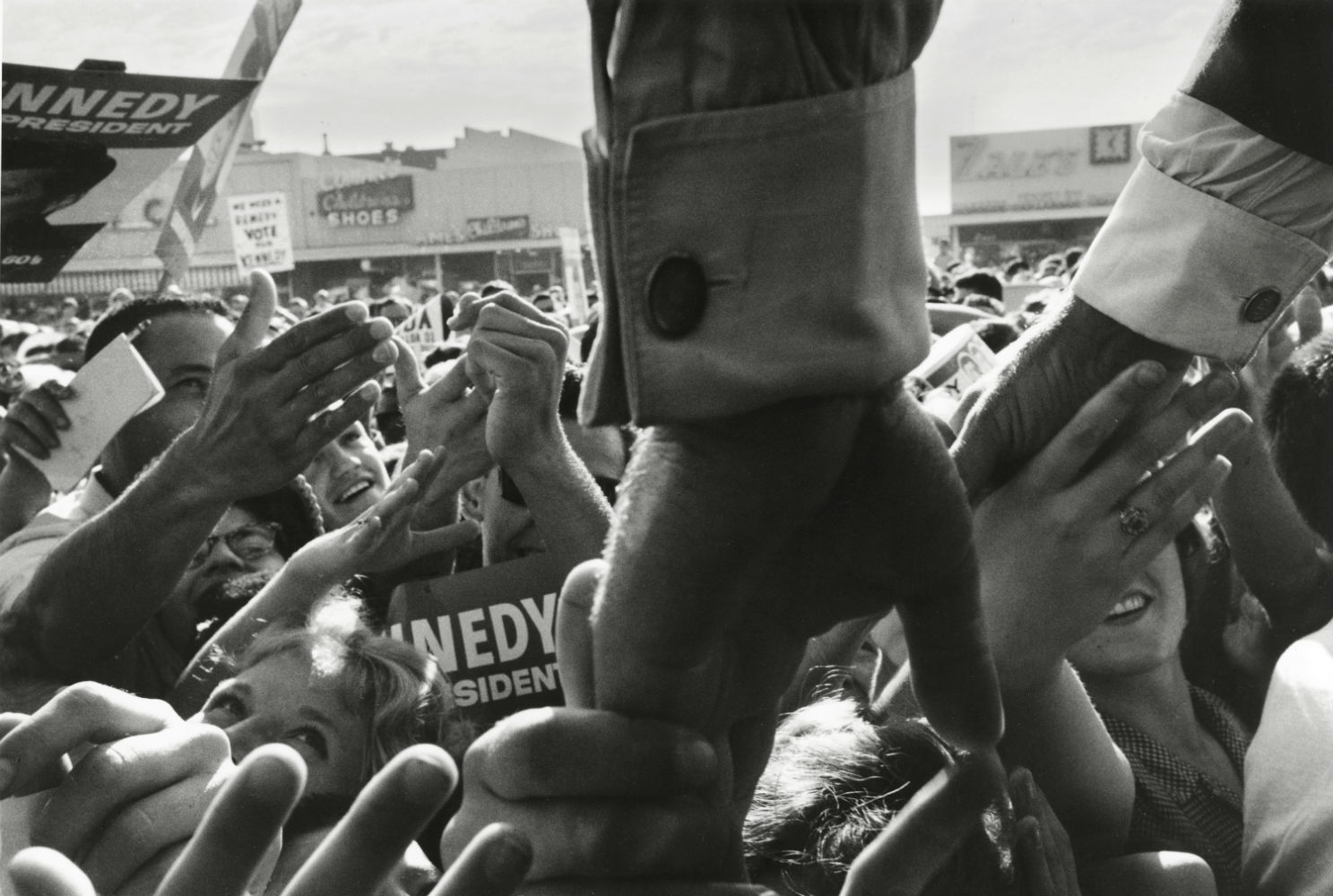 USA. 1960. California. Senator John F. KENNEDY reaches his hands into a crowd while campaigning..jpg