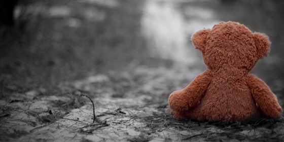 teddy-bear-sitting-alone-on-road.jpg