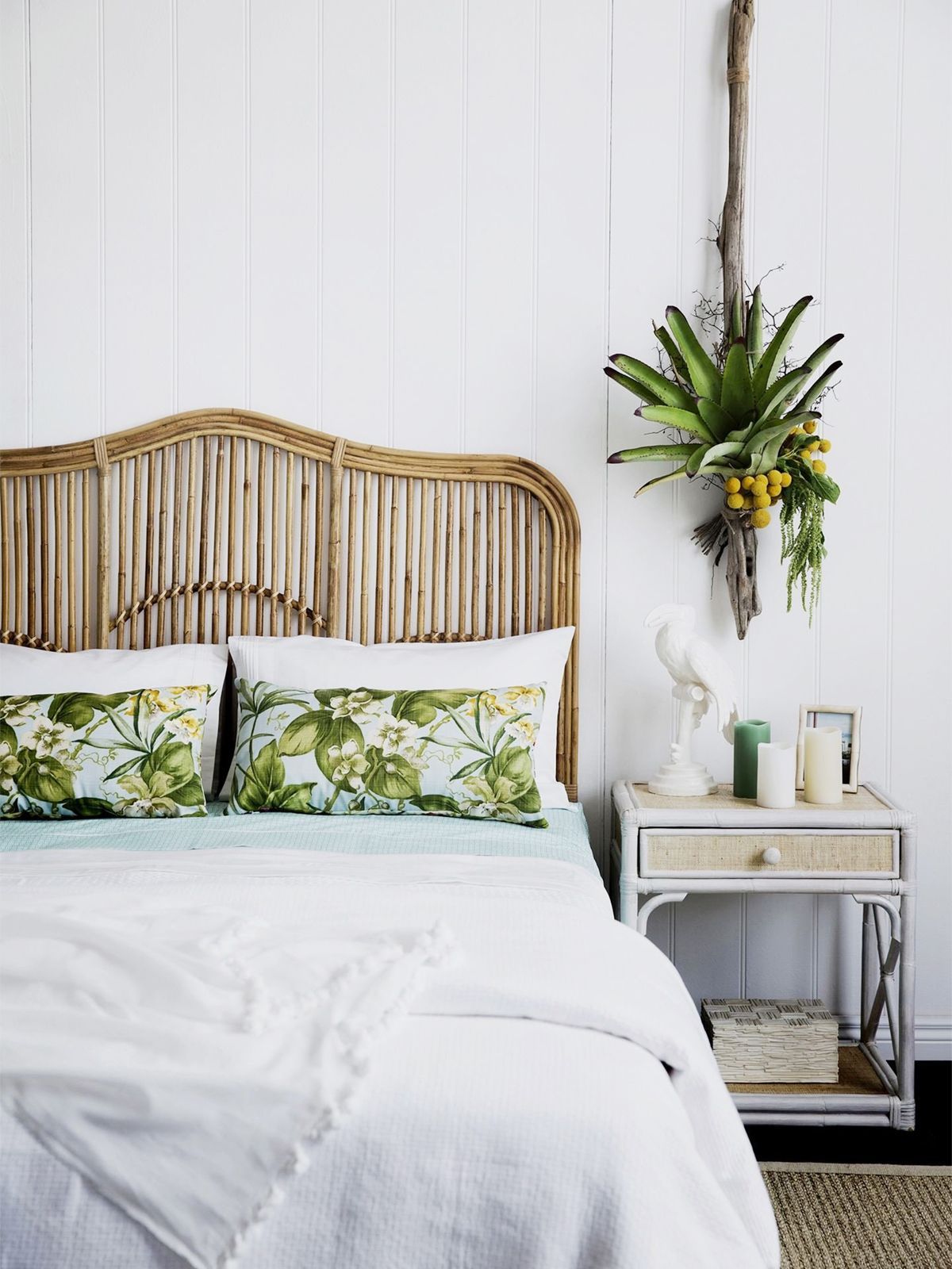 rattan-furniture-tropical-decor-bedroom-with-rattan-headboard-and-palm-leaf-pillows-via-homestolove_com_au.jpg