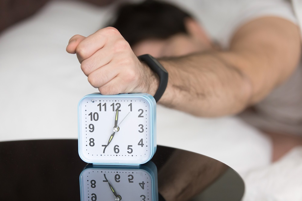 angry-sleepy-young-guy-turning-off-noisy-annoying-alarm-clock.jpg