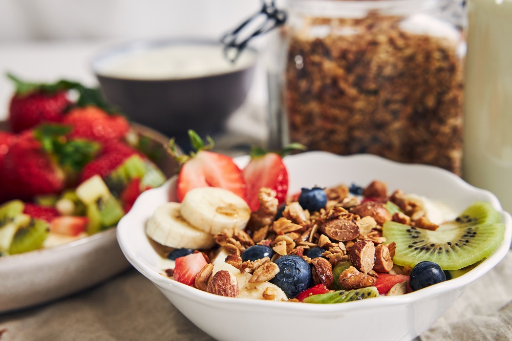 bowls-granola-with-yogurt-fruits-berries-white-surface.jpg