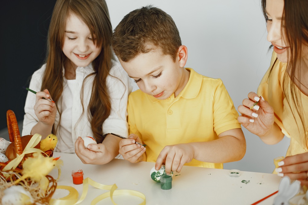 children-paint-eggs-mother-teaches-children-sitting-white-table.jpg
