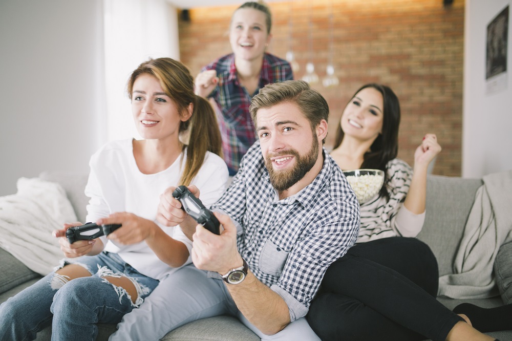 expressive-friends-playing-game-sofa.jpg