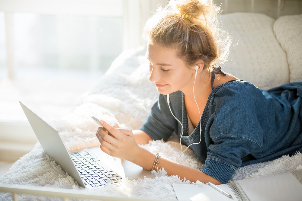 portrait-attractive-woman-lying-bed-with-laptop.jpg