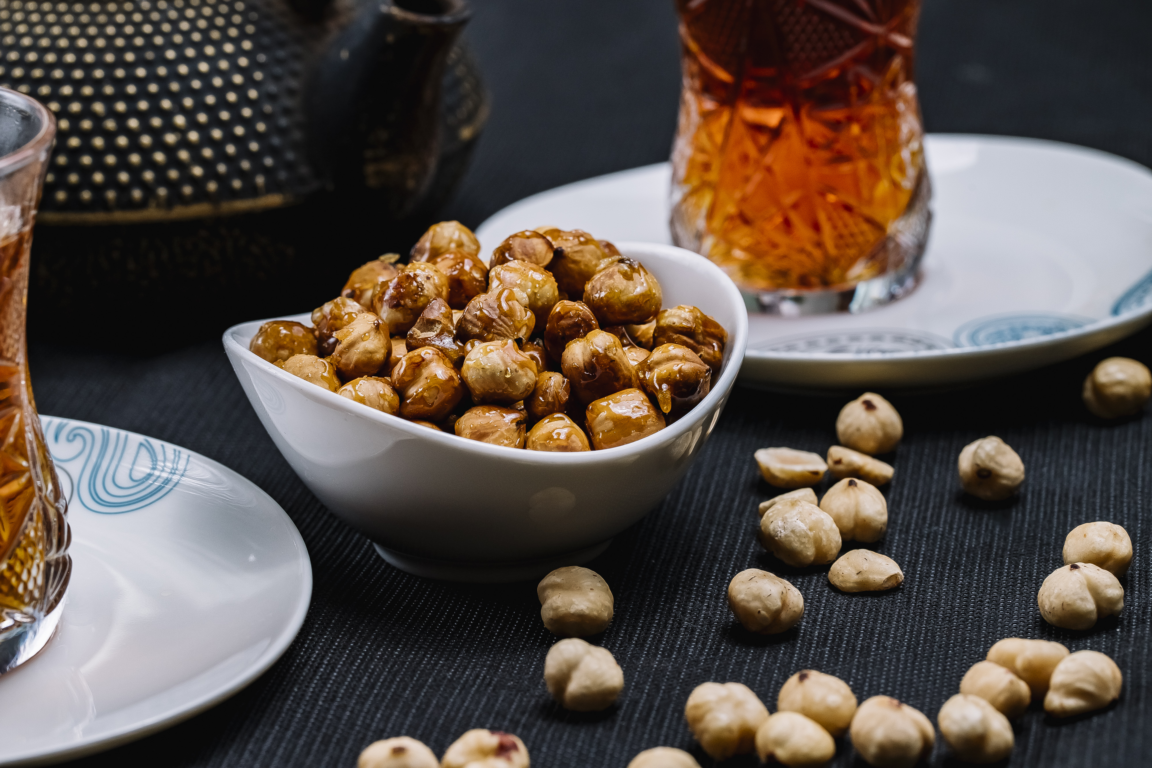 side-view-leblebi-roasted-chickpeas-with-salt-black-tea-table.jpg