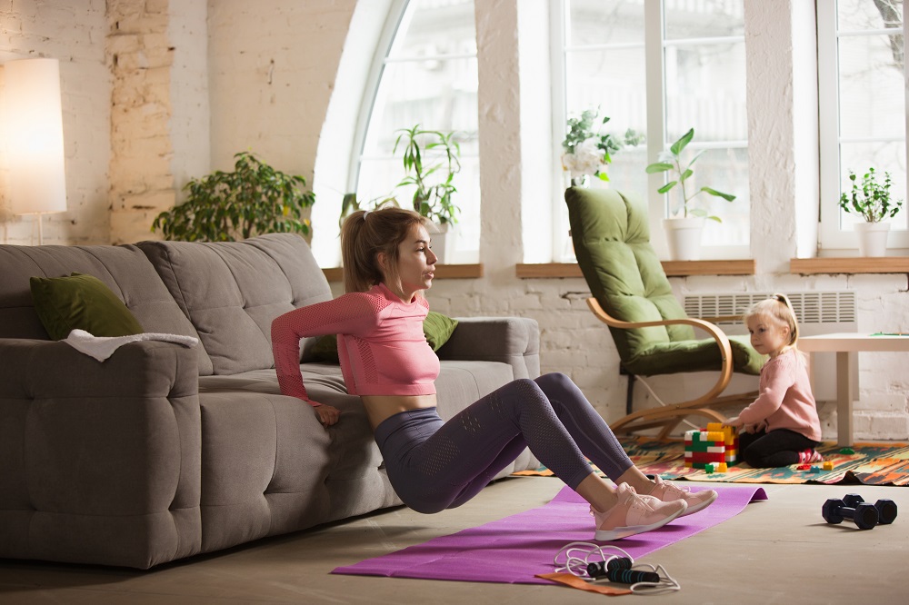 workout-with-sofa-young-woman-working-out-at-home.jpg