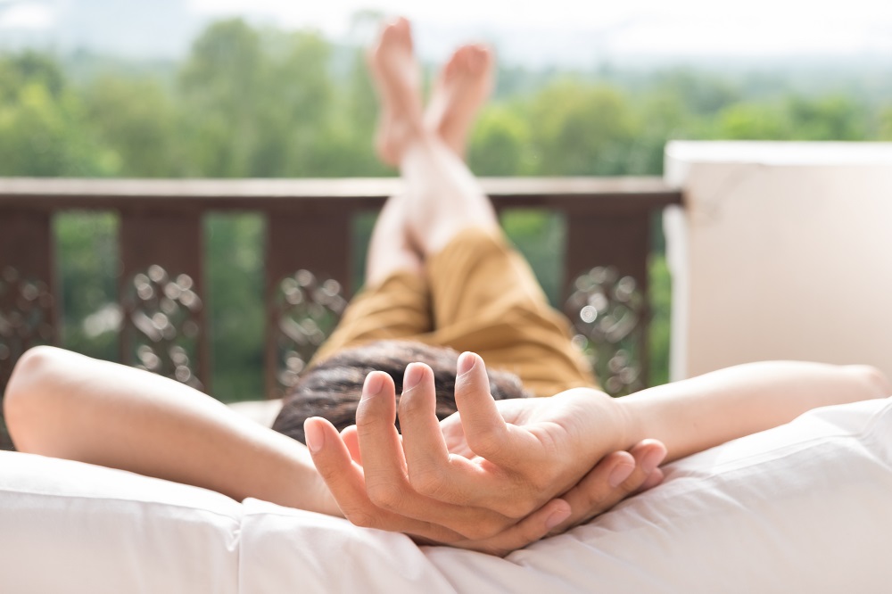 young-man-relax-bed-enjoying-mountain-view.jpg