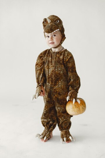 little-boy-toddler-dressed-brown-costume-dinosaur-holding-pumpkin-boy-has-hood-with-dino-s-face_1157-49679.jpg