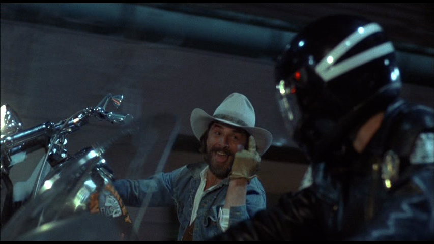 Harley-Davidson-and-the-Marlboro-Man-Don-Johnson-motorcycle-wheelie-cop-middle-finger.png