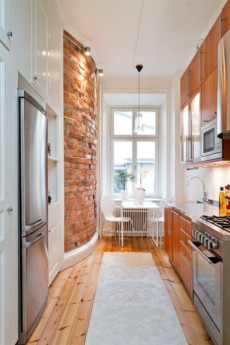 beautiful-curved-exposed-brick-wall-in-this-small-modern-kitchen.jpg