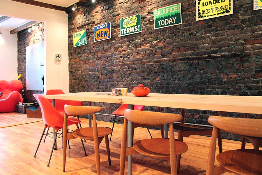 eclectically-vintage-dining-room-with-brick-wall-and-a-splash-of-color.jpg