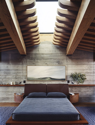 interior_shot_of_a_bedroom_with_wooden_ceiling_and_concrete_walls.png