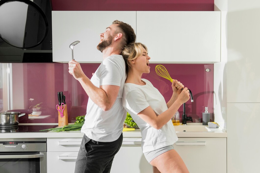 couple-indoors-singing-kitchen-front-view_23-2148593229_1.jpg