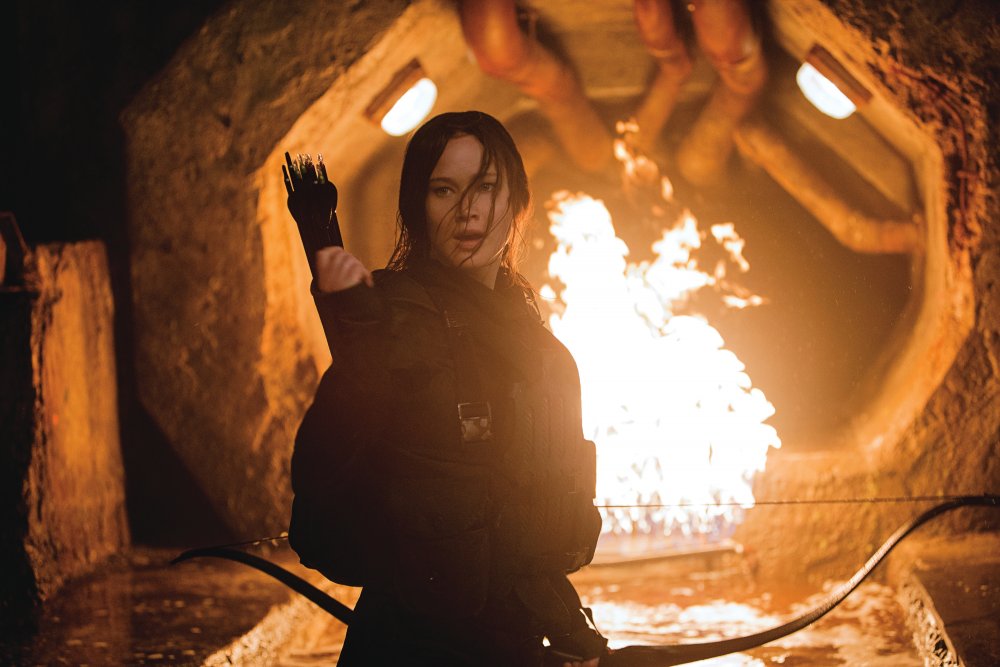 hunger-games-mockingjay-part-two-the-2015-004-kaniss-in-front-of-tunnel-fire.jpg
