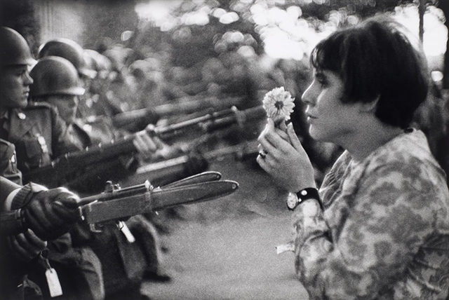 a-vietnam-war-protester-brings-a-flower-to-soldiers-in-washington-dc-on-oct-21-1967-nearly-100000-people-came-out-to-protest.jpg