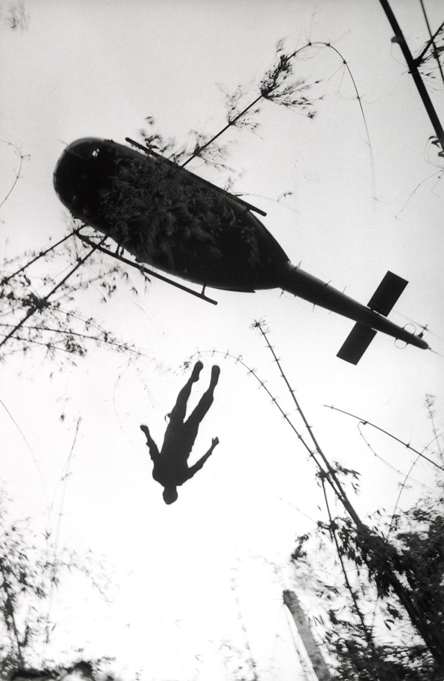 an-evacuation-helicopter-in-vietnam-raises-the-body-of-an-american-paratrooper-killed-in-action-in-the-jungle-near-the-cambodian-border-in-1966.jpg