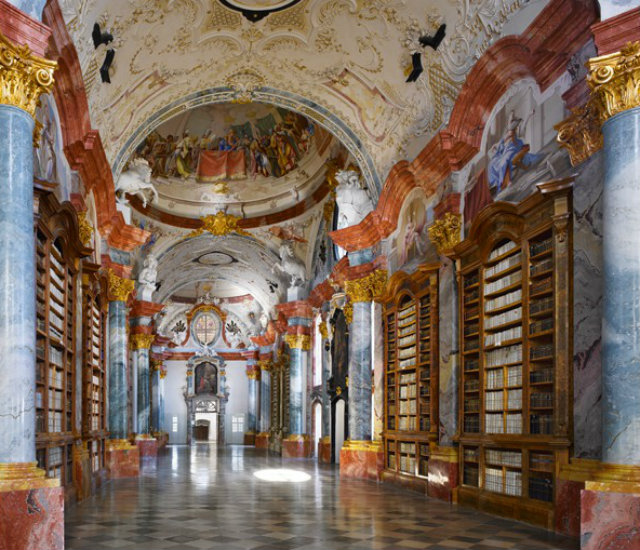 the_highly_ornamented_library_of_altenburg_abbey_in_lower_austria_is_the_work_of_the_baroque_architect_joseph_muggenast_and_is_decorated_with_frescoes_by_paul_trogermod2mod2.jpg