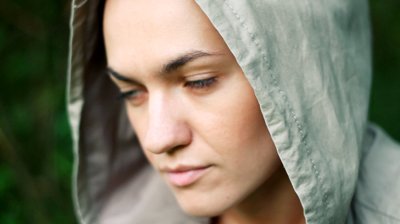 stock-footage-sad-woman-in-the-hood-in-the-park-camera-stabilizer-shot.jpg