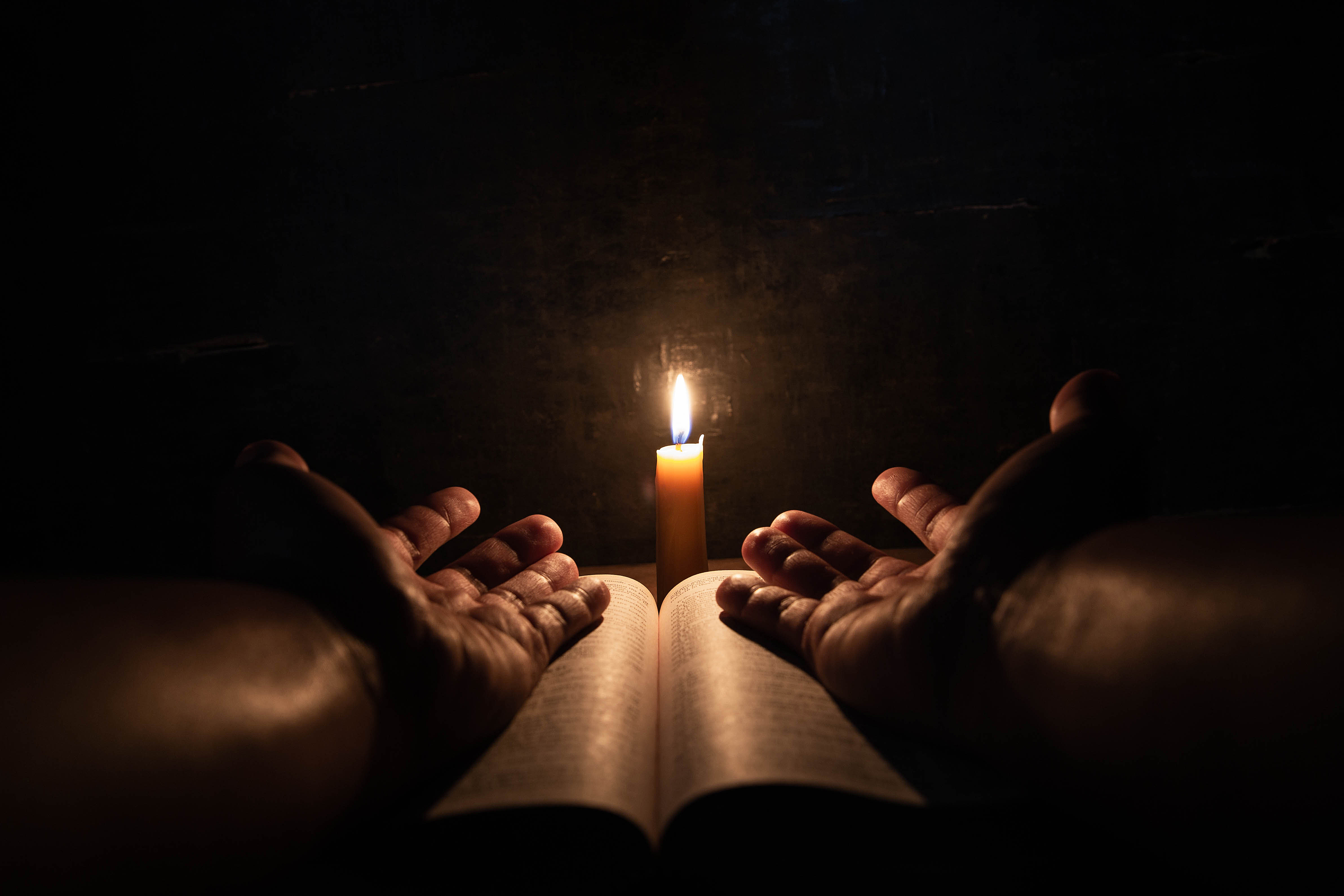 men-praying-bible-light-candles-selective-focus.jpg