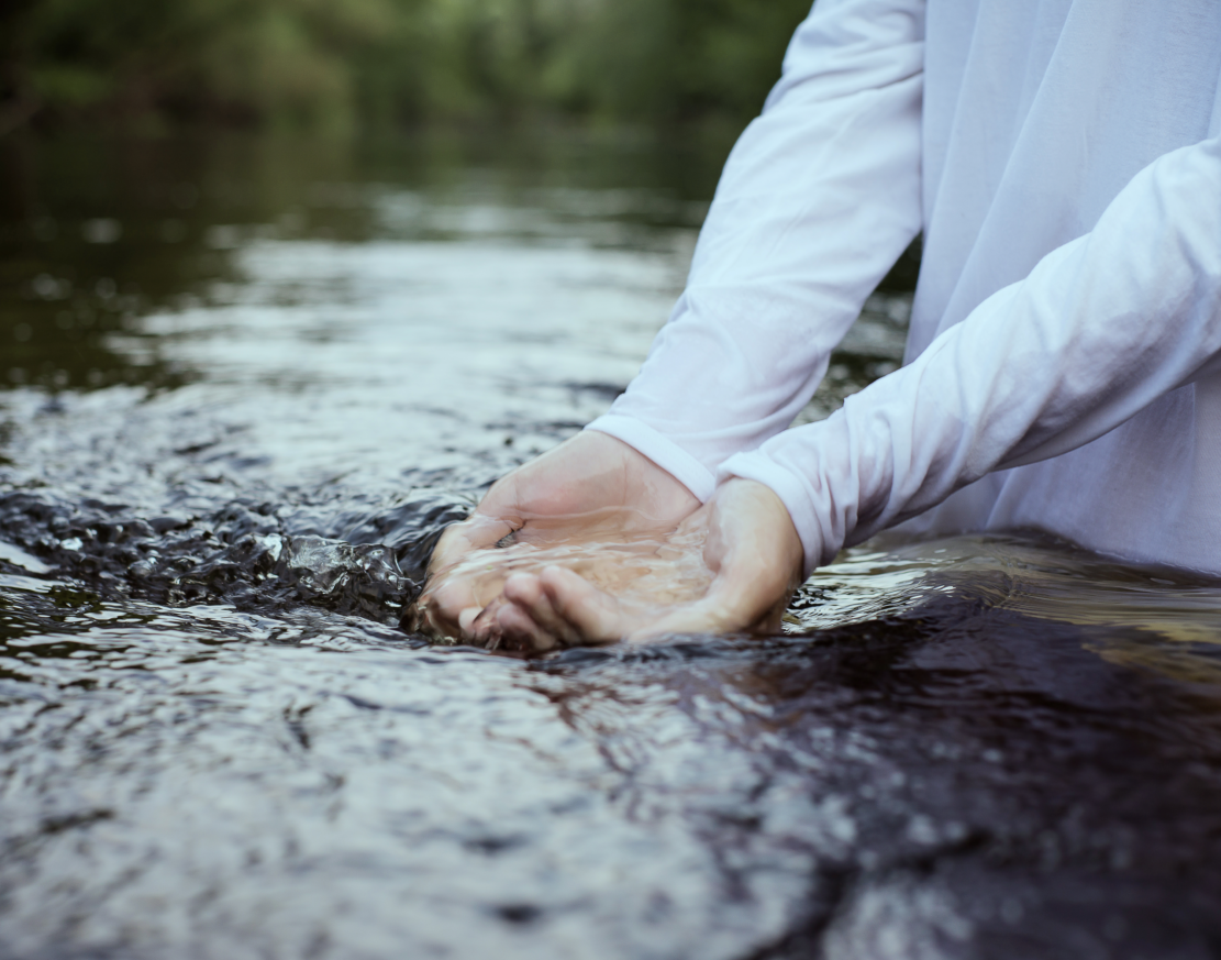 midsection-ing-with-hands-cupped-lake.png
