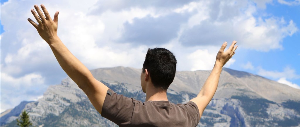 prayer-man-with-lifted-hands-in-front-of-mountain.jpg