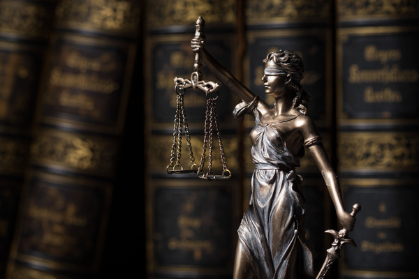 statue-of-the-goddess-of-justice-and-legal-books-stock-photo-02.jpg