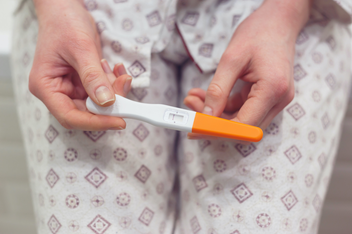 rapid-pregnancy-test-with-negative-result-in-woman-lzxqsdz.jpg