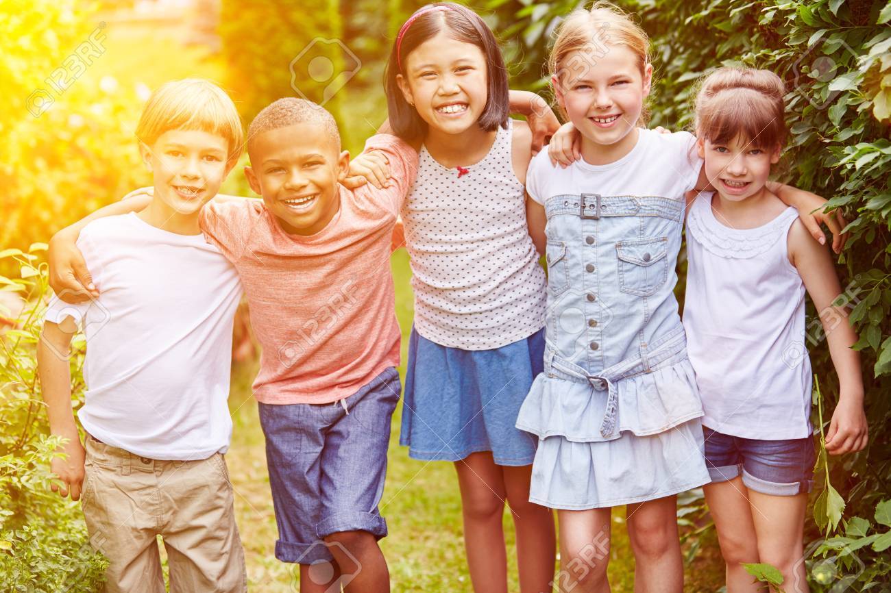 71633976-group-of-children-smiling-as-friends-together-in-summer-in-garden.jpg