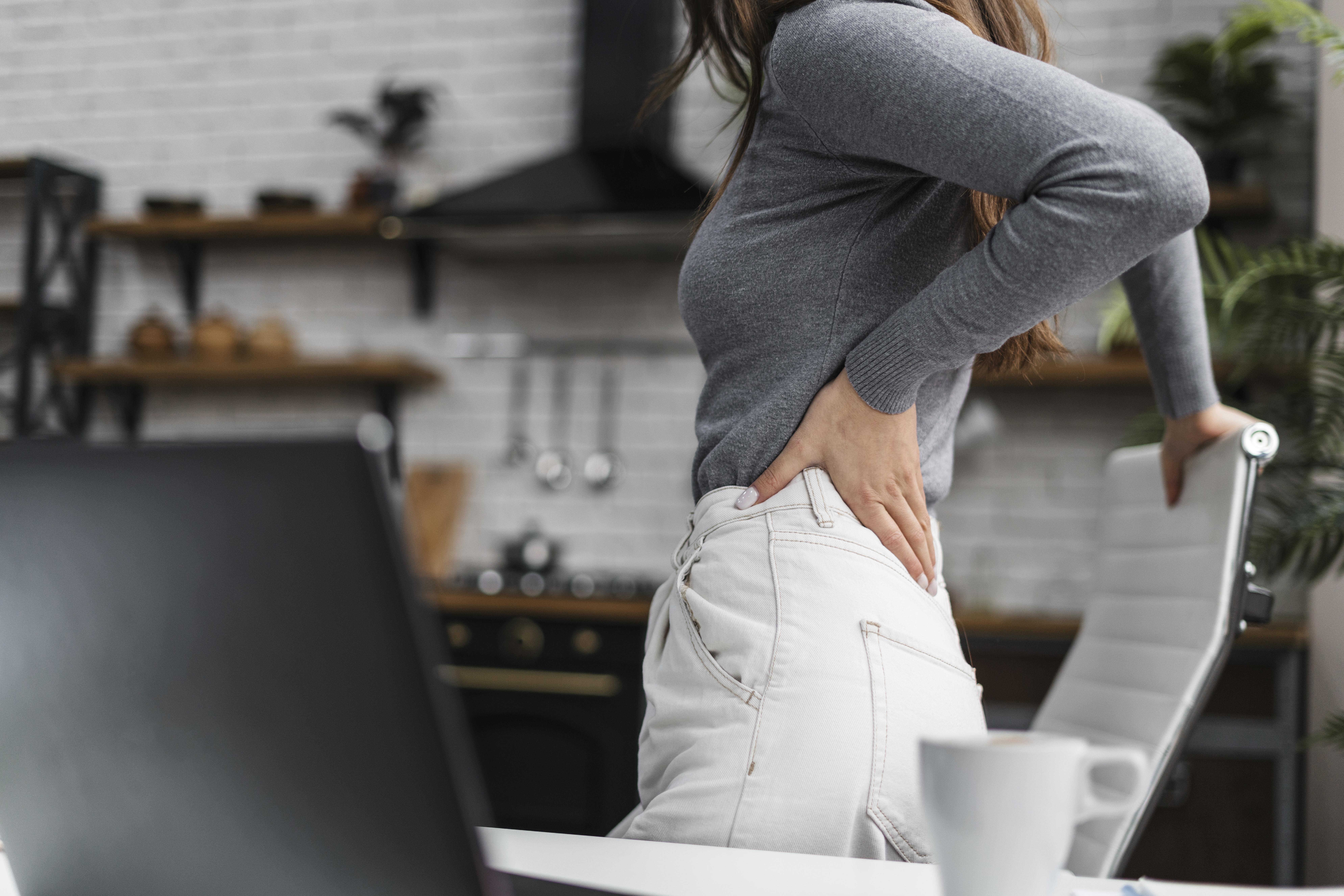 side-view-woman-having-backache-while-working-from-home.jpg