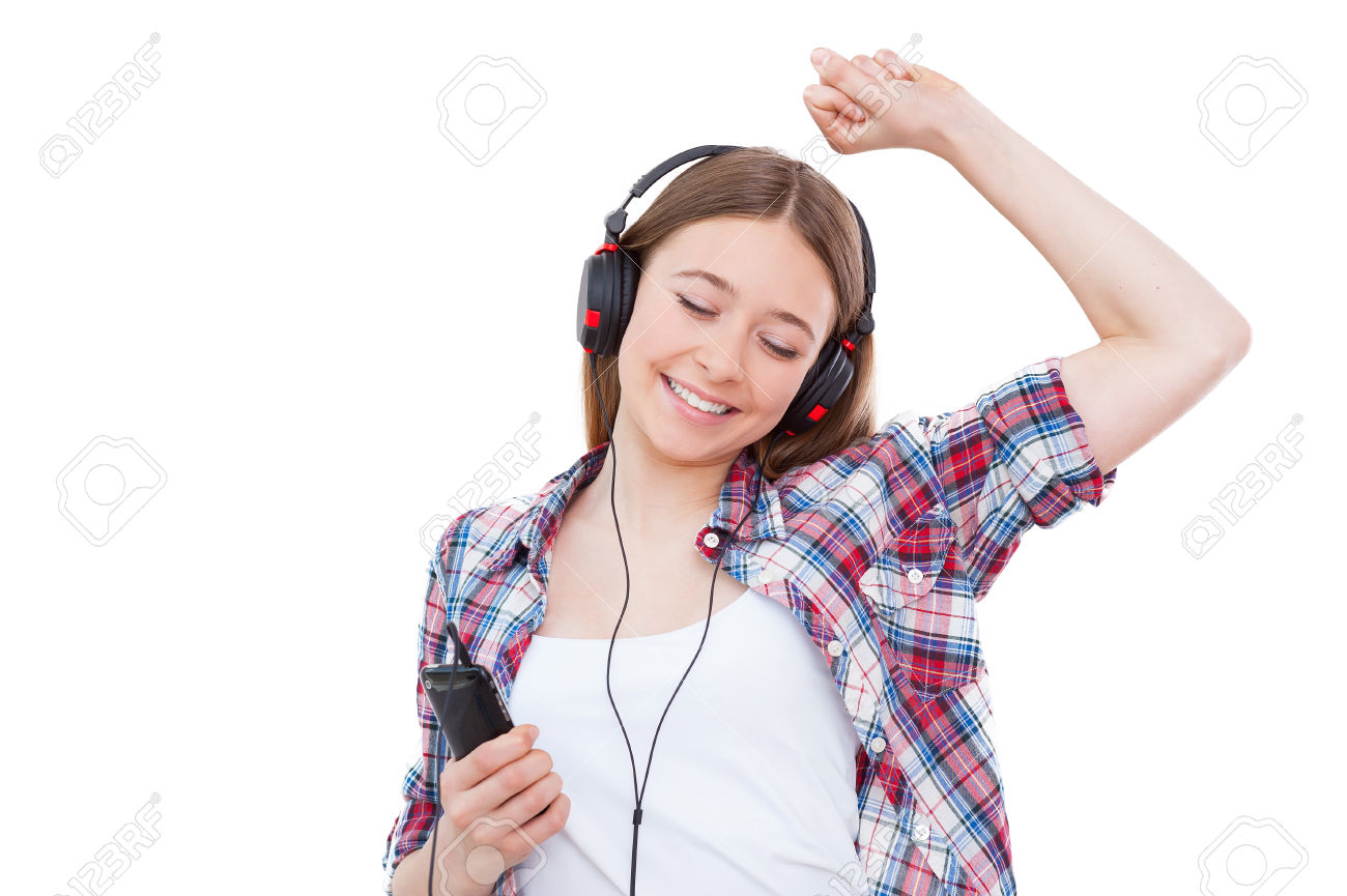 28205915-enjoying-her-favorite-music-cute-teenage-girl-in-headphones-listening-to-the-music-and-dancing-while-stock-photo.jpg