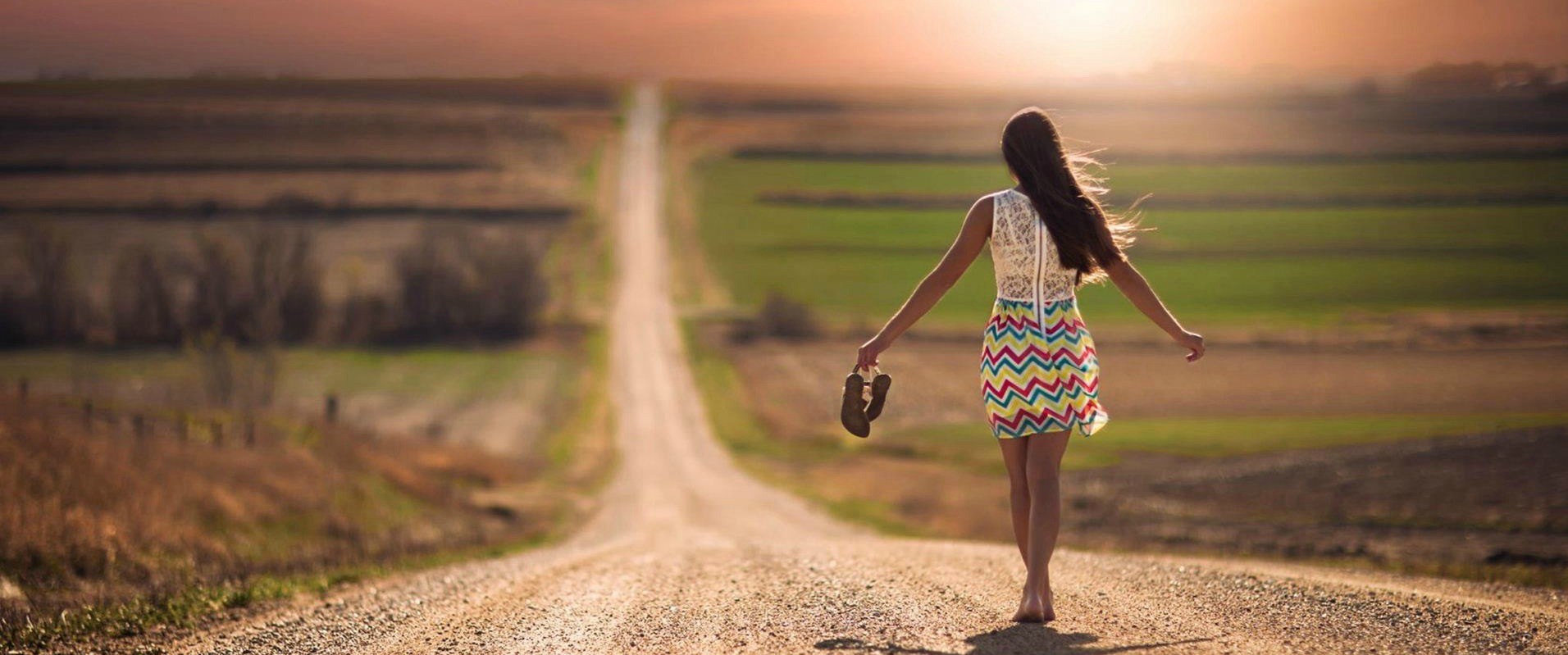 lonely-girl-walking-on-road.jpg