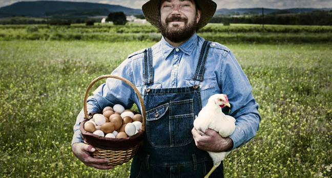 free_range_chicken_and_farmer_photo_via_shutterstock.jpg