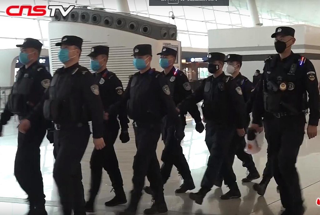 1024px-policemen_wearing_masks_patrolling_wuhan_tianhe_airport_during_wuhan_coronavirus_outbreak.jpg