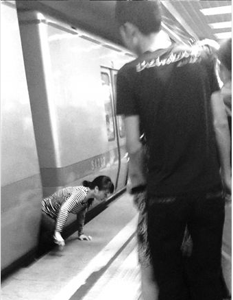 A-Beijing-Woman-Still-Alive-After-a-Subway-Run-Her-Over.png
